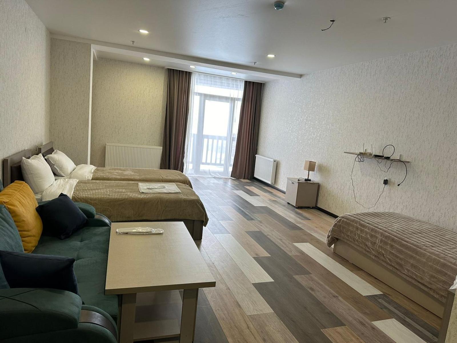 Hotel Qumli Гудаури Экстерьер фото